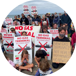 Protestors holding signs saying no more gas at Corio Bay
