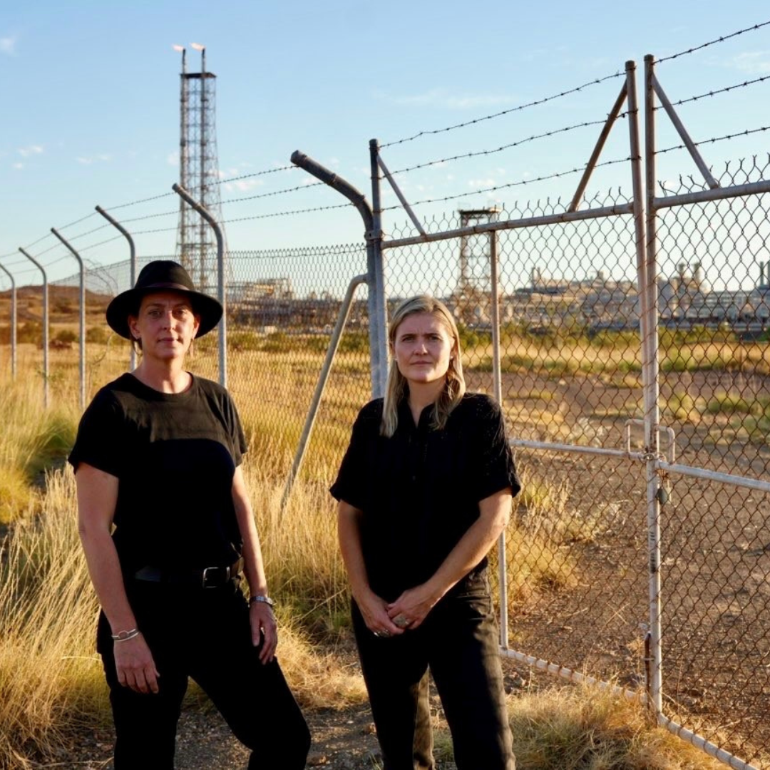 Sophie McNeill with WA MLC colleague Jess Beckerling in front of Woodside's North West Shelf gas processing plant, May 2025