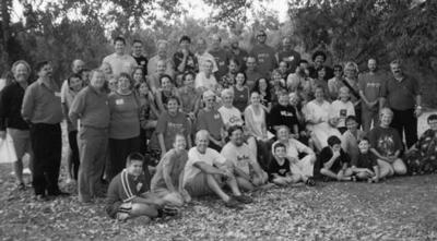 black and white photograph of a group of greens volunteers standing in rows.