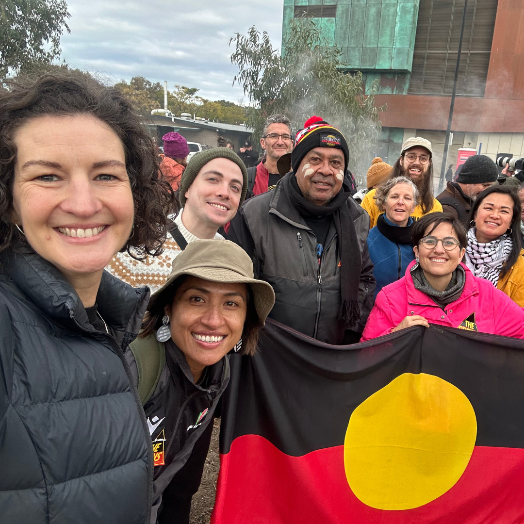 Image of Elllen Sandell and Victorian MPs at Walk For Truth in Victoria earlier this year holding the Aboriginal Flag