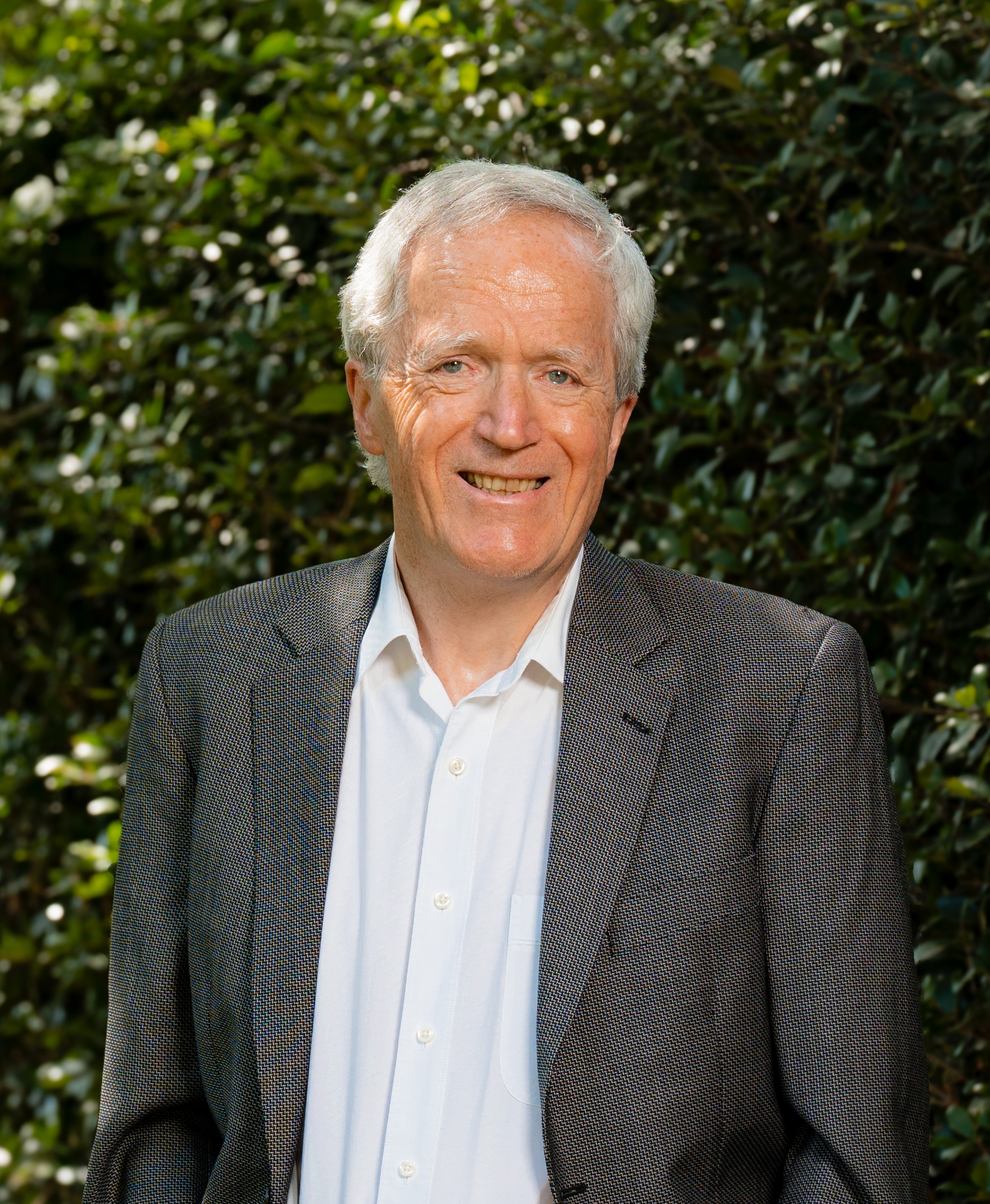David Wright in front of a leafy green background
