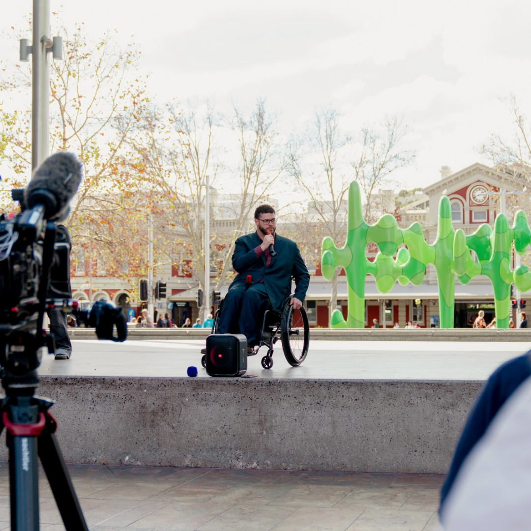 Jordon Steele-John speaking at NDIS rally