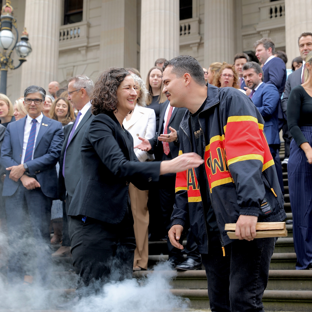 Ellen Sandell on steps of Parliament during smoking ceremony in Victoria