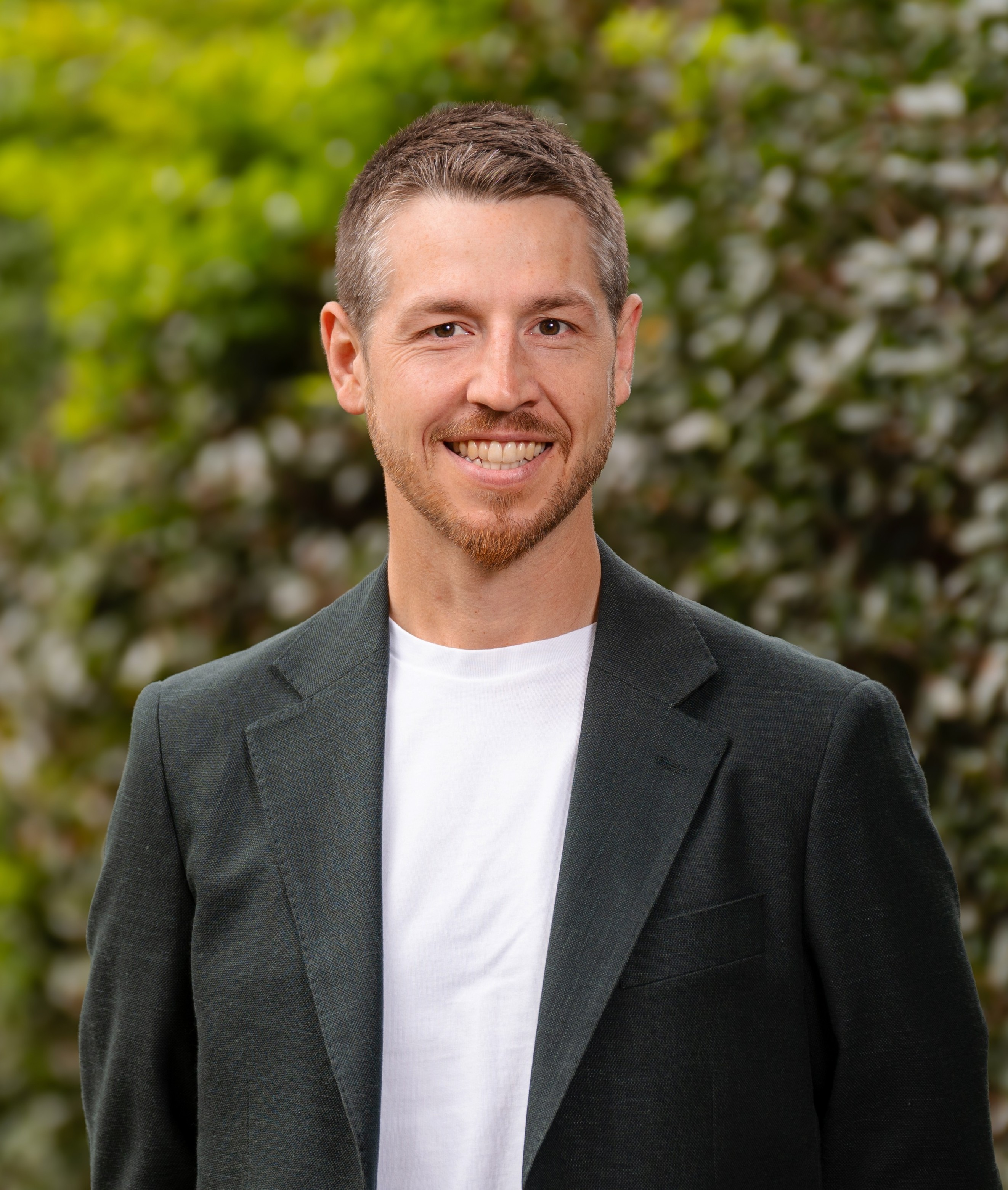 Hayden Shaw with green leafy background