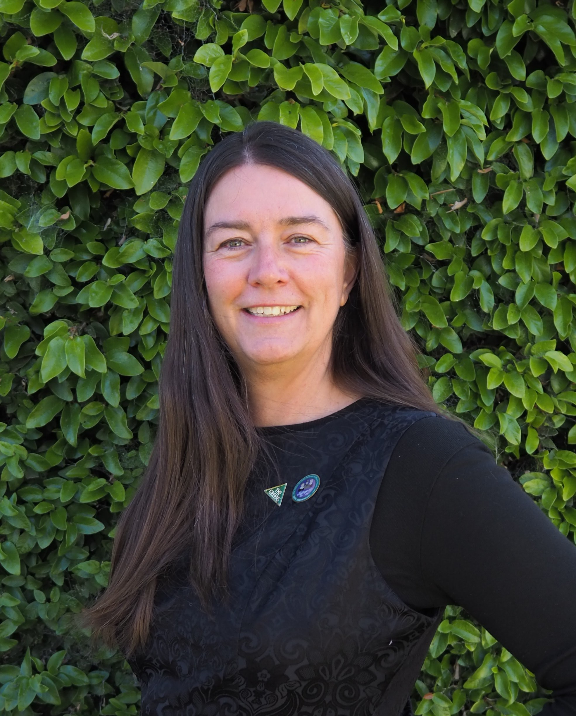 Image of Kathryn Hardwick-Franco, with leaves in the background