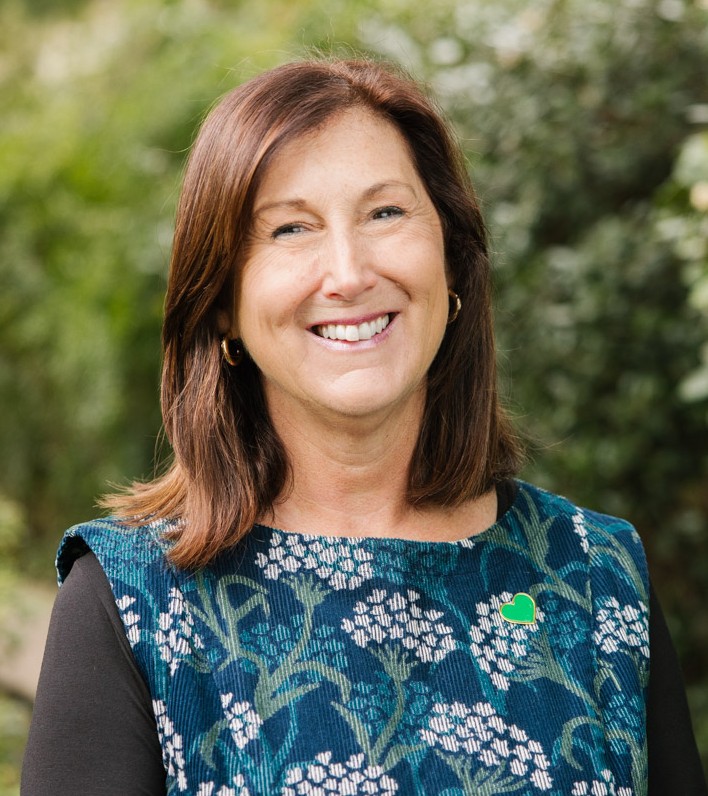 Image of Christel Mex with blurred leafy background