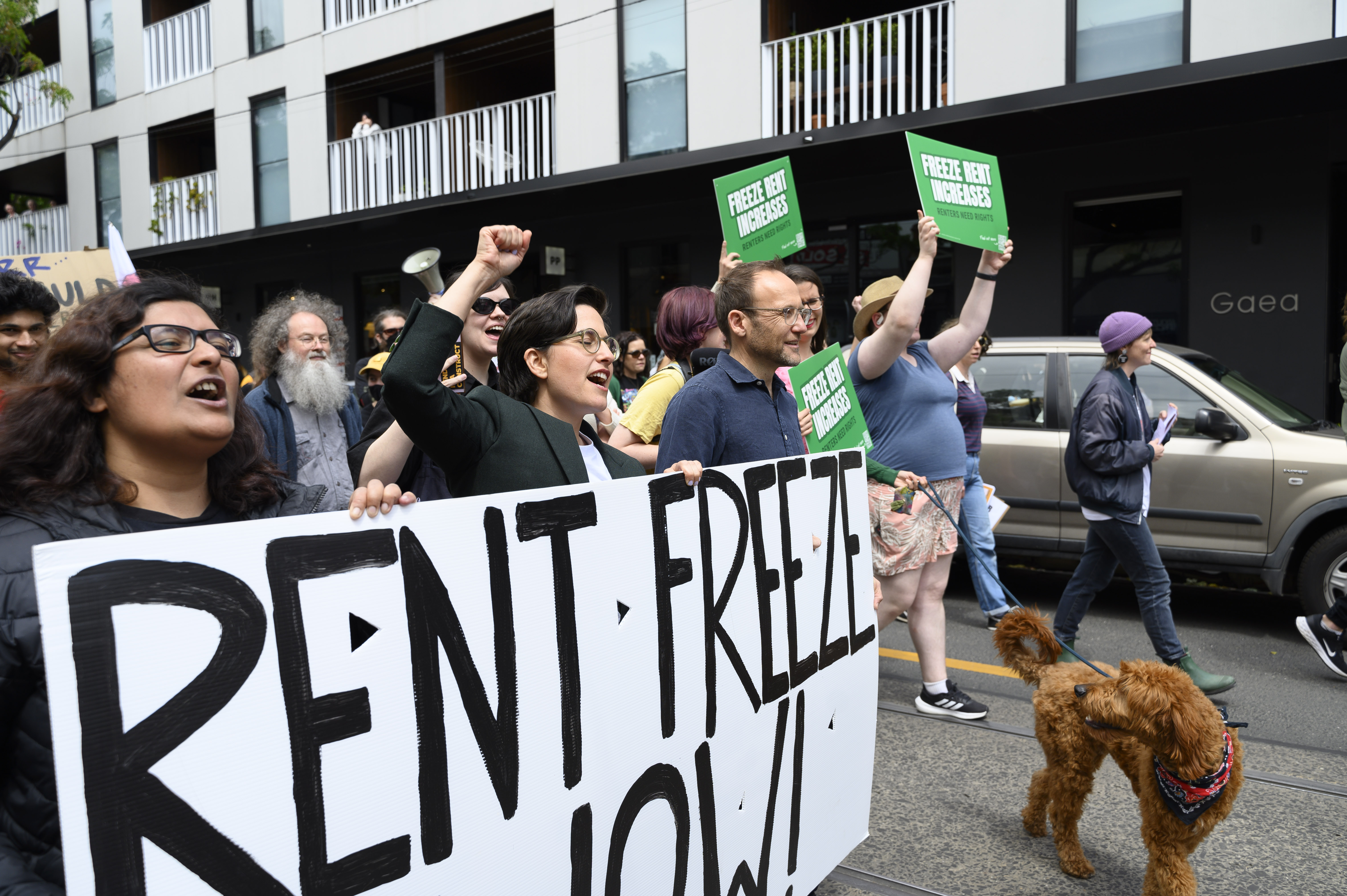 Adam Bandt, Gabrielle Di Vietri and renters marching at the renters rally