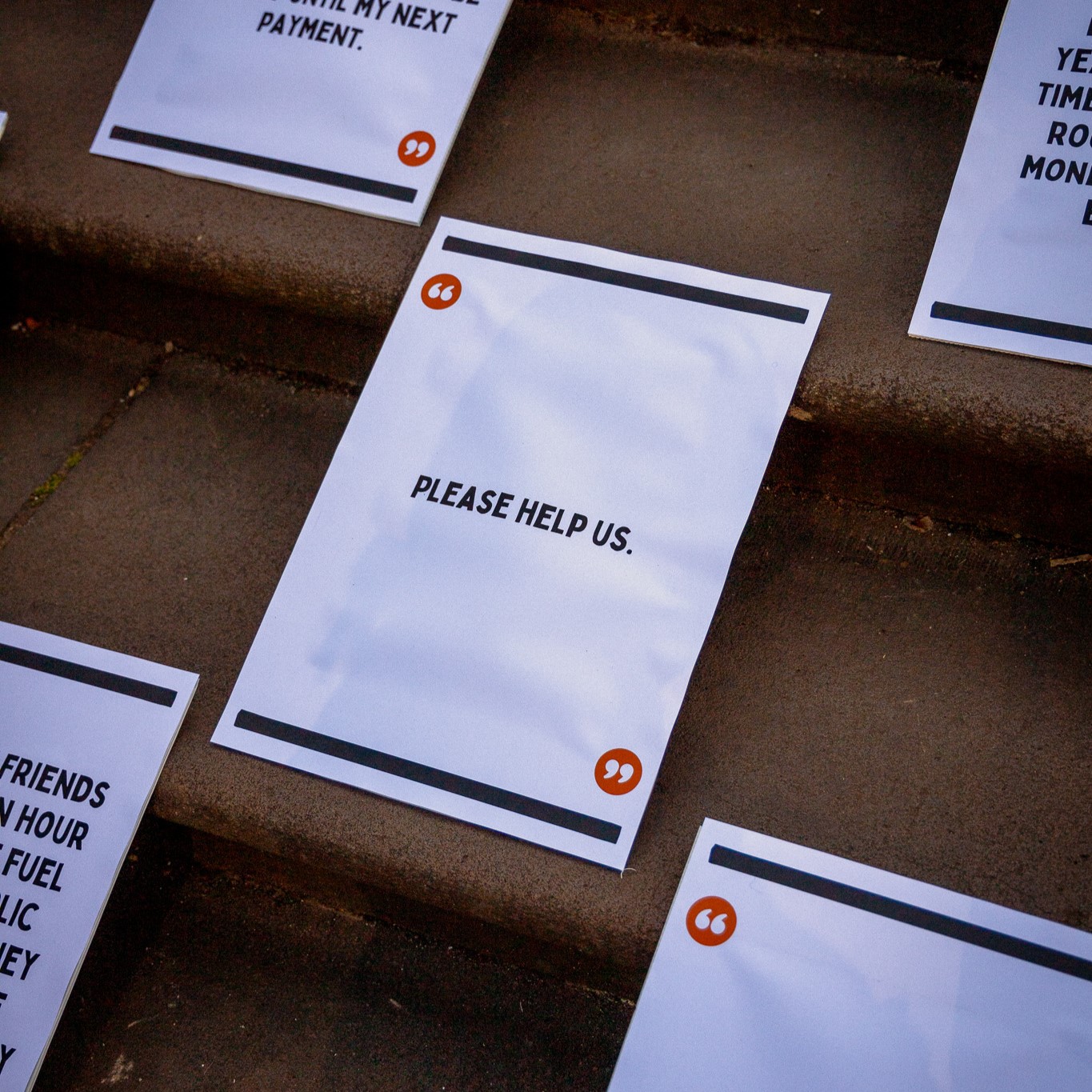 Sign from cost of living survey respondent reads: "please help us"