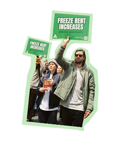protest marchers holding freeze rent increases signs